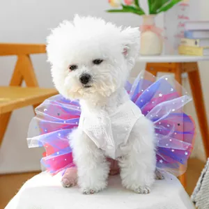 Detail of dog dress with white waffle texture top and colorful starry tulle skirt layer