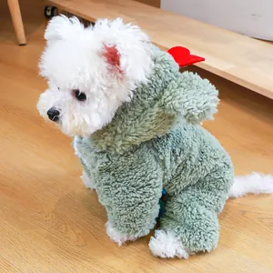 Detail of green plush hooded pet jumpsuit with red heart accents on a Pomeranian