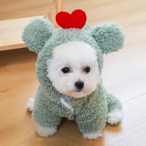 Detail of green fleece pet hoodie featuring cute bear ears and a red heart decoration