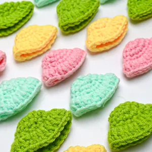 Detail of colorful hand-crocheted mini hats for pets in vibrant macaron yarn tones