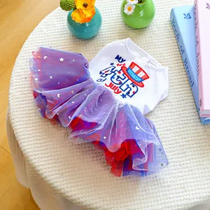 Close-up of Fourth of July dog dress with patriotic mesh tutu and star print details