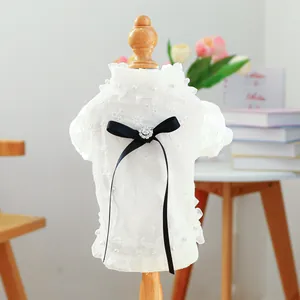 Lace dog dress with floral embroidery, pearl accents and a large black bow for small dogs