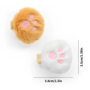 Detail of plush cat paw pet hair clips showing 3.8cm size and soft embroidery texture
