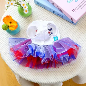 Close-up of white lace pet dress with layered colorful mesh tutu and silver star sequins