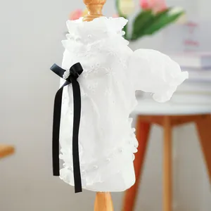 Elegant white floral lace dog shirt with black bow and pearl details for small pets