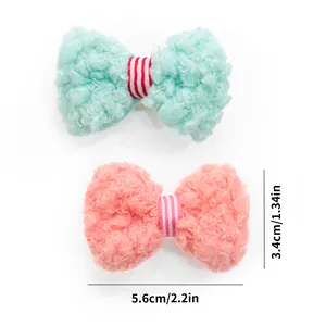 Detailed size parameters for mint green and pink plush bow hair clips for pets