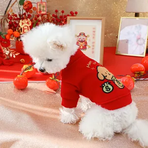 Detail of red festive pet sweater with dog embroidery and Happy New Year text