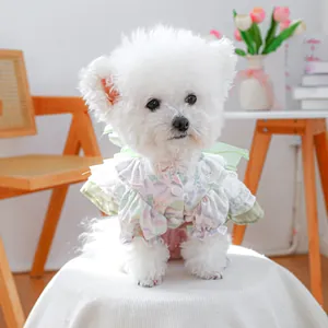 Detailed close-up of floral pet dress with layered ruffles and bubble sleeves for small dogs