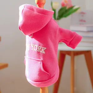 Detail of pink dog hoodie with New York embroidery and integrated metal leash D-ring