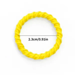 Detail showing a 2.3cm yellow twisted rope textured hair ring for cats and dogs