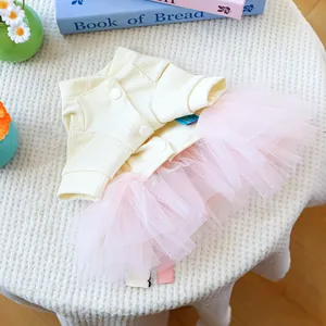 Detail of pet dress featuring knit rib bodice with buttons and pink layered mesh tutu skirt