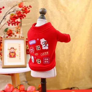 Detail of red festive pet hoodie with traditional New Year embroidery and soft fabric