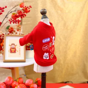 Detail of red festive pet sweatshirt with high-quality embroidery and soft fleece texture