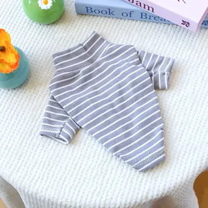 Detail view of the grey and white striped dog sweater featuring ribbed cotton knit texture