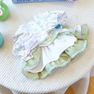 Close-up of pet summer floral dress with ruffle edges and buttons for small dogs