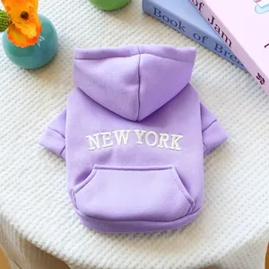 Close-up of lavender dog hoodie with white New York embroidery and back pocket detail