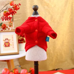 Close-up of red festive pet hoodie with three buttons and thick warm fabric