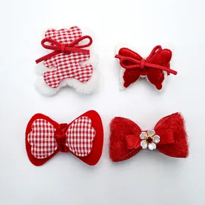 Detail of 4pcs red and white pet hair clips set with cute bear and bowknot shapes