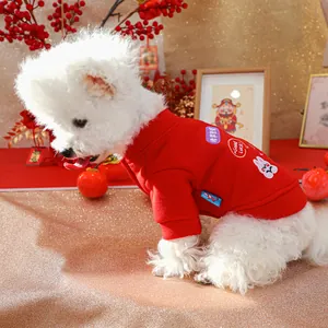Detail of red festive pet hoodie with bunny embroidery and Good Luck text for dogs