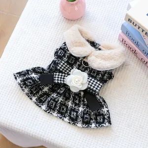 Detail of pet houndstooth dress with faux fur collar and 3D camellia flower