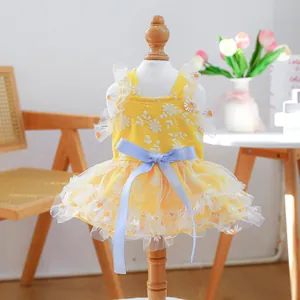 Yellow pet dress with white daisy embroidery, blue ribbon bow and layered lace tutu skirt