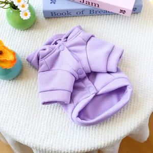 Detail of light purple pet sweatshirt with resin buttons and vertical textured knit fabric