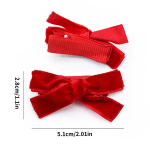 Detailed view of red velvet pet bow clips with exact dimensions 5.1cm by 2.8cm