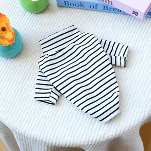 Detail of black and white striped knit dog sweater with ribbed texture and high collar