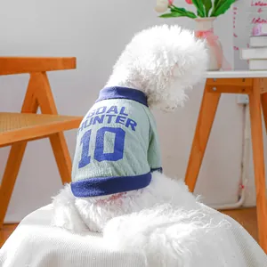 Detail of pet vest showing Goal Hunter 10 print on soft green fabric for small dogs