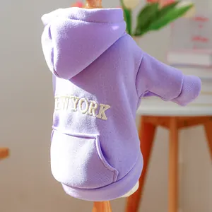 Detail of light purple pet hoodie featuring New York embroidery and decorative pocket