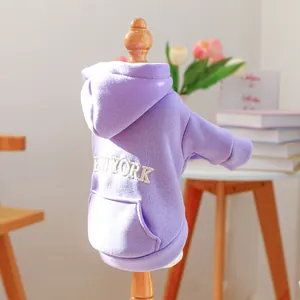 Detail of purple dog hoodie featuring New York embroidery and functional back pocket