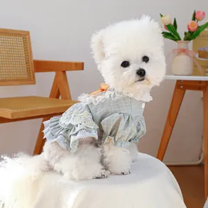 Green plaid dog dress with white lace trim and yellow bow for small pets