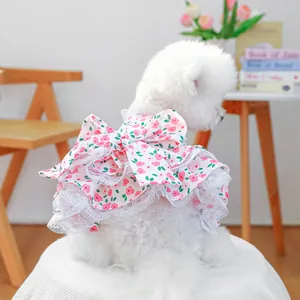 Detail of pet floral dress with a large 3D bow and layered lace hem for small dogs