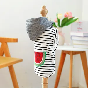 Detail of striped dog hoodie with a glittery watermelon patch and waffle texture hood