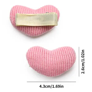 Detail view of pink knitted heart pet hair clips showing 4.3cm length and back clip structure