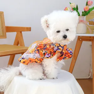 Detailed view of floral pet dress with lace edges and translucent wings for small dogs