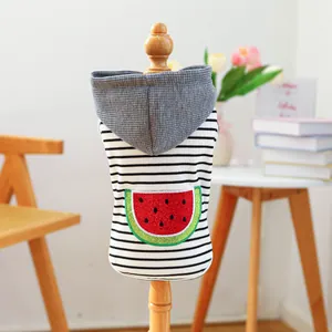 Striped pet hoodie with sequin watermelon patch for small dogs on a wooden mannequin