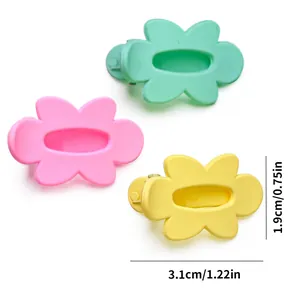 Detail view of 3.1cm matte flower hair clips for pets in pink, yellow, and mint colors