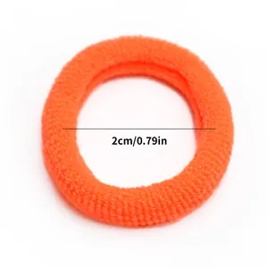 Macro shot of bright orange elastic pet hair band with a diameter of 2cm or 0.79 inches
