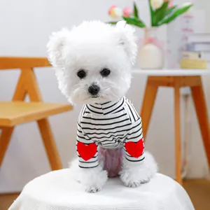 Detail of striped pet sweater with red heart patches on sleeves for small dogs