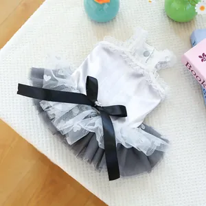 Detail of pet dress featuring lace trim, heart mesh skirt, and a sparkling ribbon bow