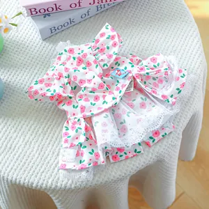 Close-up of floral dog dress featuring delicate lace trim and sweet ruffle collar details