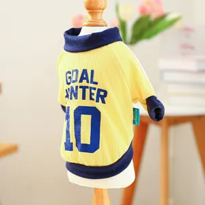 Close-up of yellow and blue pet sports jersey with Goal Hunter 10 print on the back