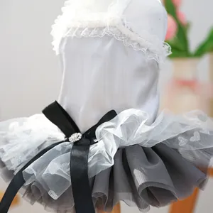 Detail of pet princess dress with white lace collar, black bow and sequin heart mesh