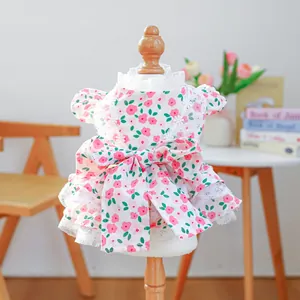 Detail of pet floral dress with large bow, layered lace hem and exquisite embroidery