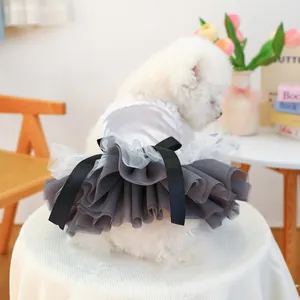 Detail of grey satin pet dress with heart sequins, lace collar and large black bow