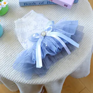Detail of pet fairy wedding dress with blue starry mesh skirt and lace flower embroidery