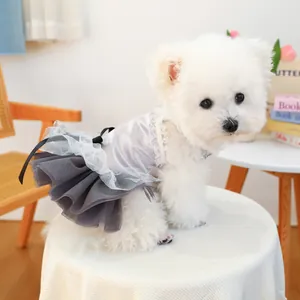 Detail of dog dress featuring silver satin top with delicate lace and tulle skirt
