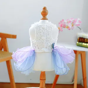 Exquisite white lace pet dress with multi-layered lavender and blue tulle on a mannequin