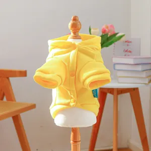 Detail of yellow pet hoodie with buttons and ribbed cuffs for small dogs